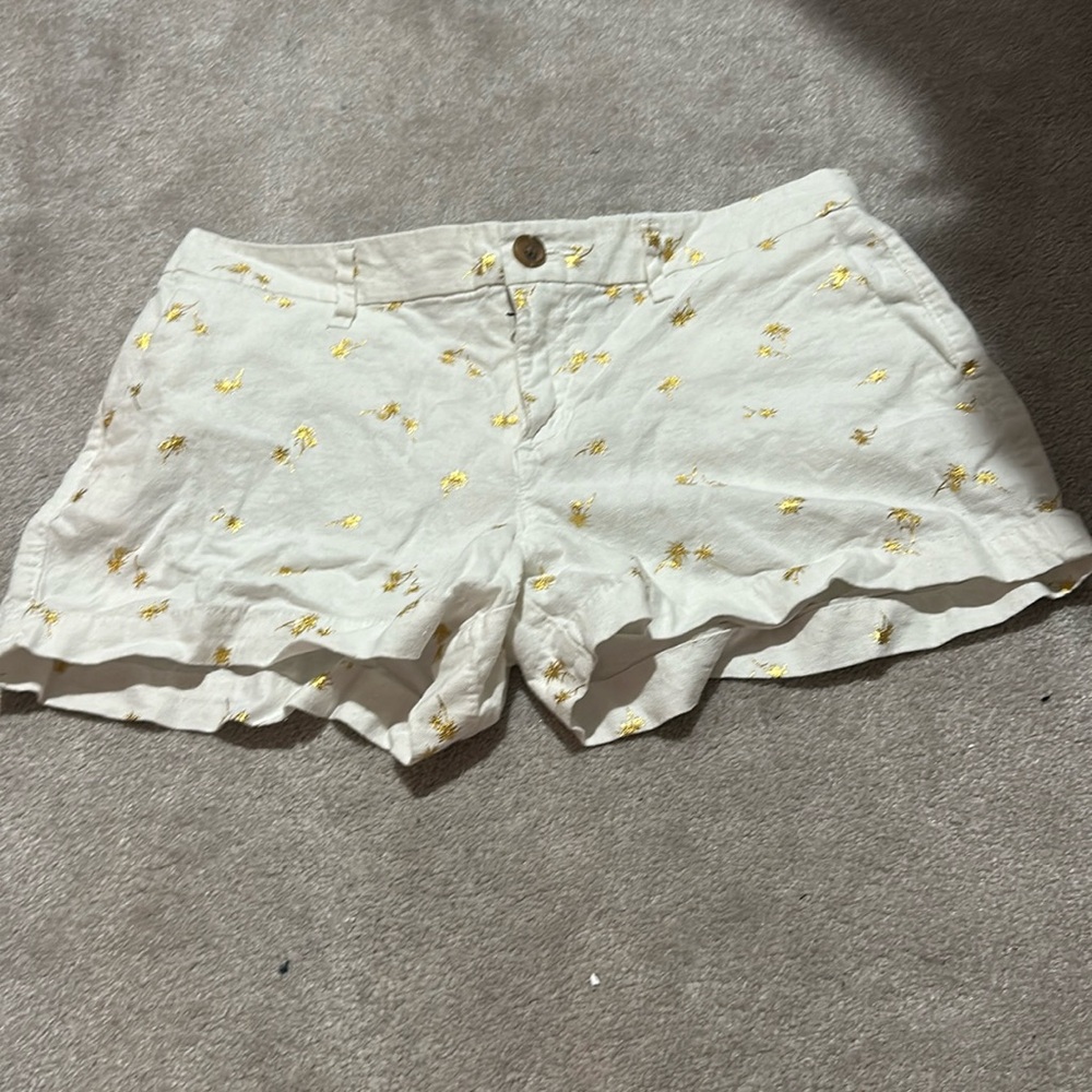 Old Navy size 4 white shorts with gold palm trees. Perfect used condition.